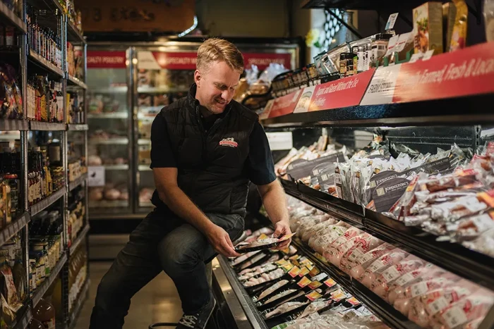Stocking product coolers in the farm store