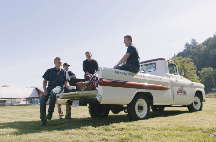 The family with the original Fraser Valley Specialty Poultry farm truck